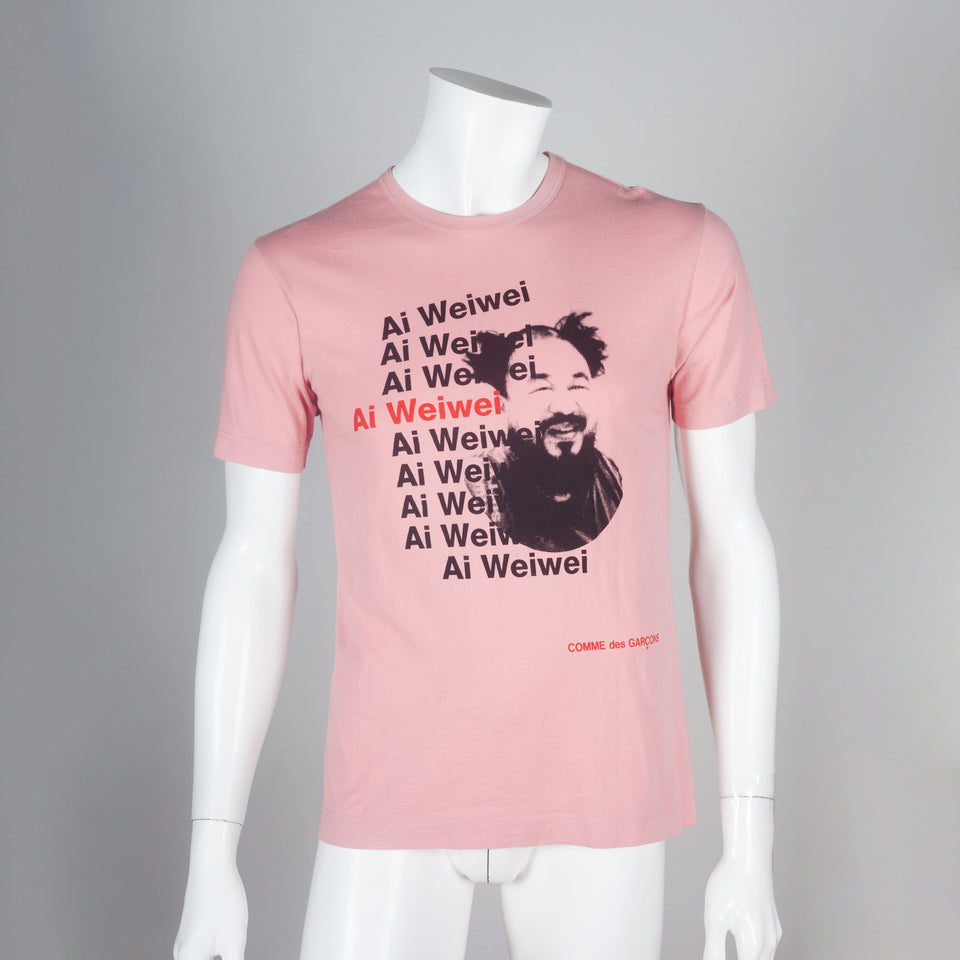 Comme des Garçons pink 2010 tee featuring portrait of Chinese artist, Ai Weiwei.