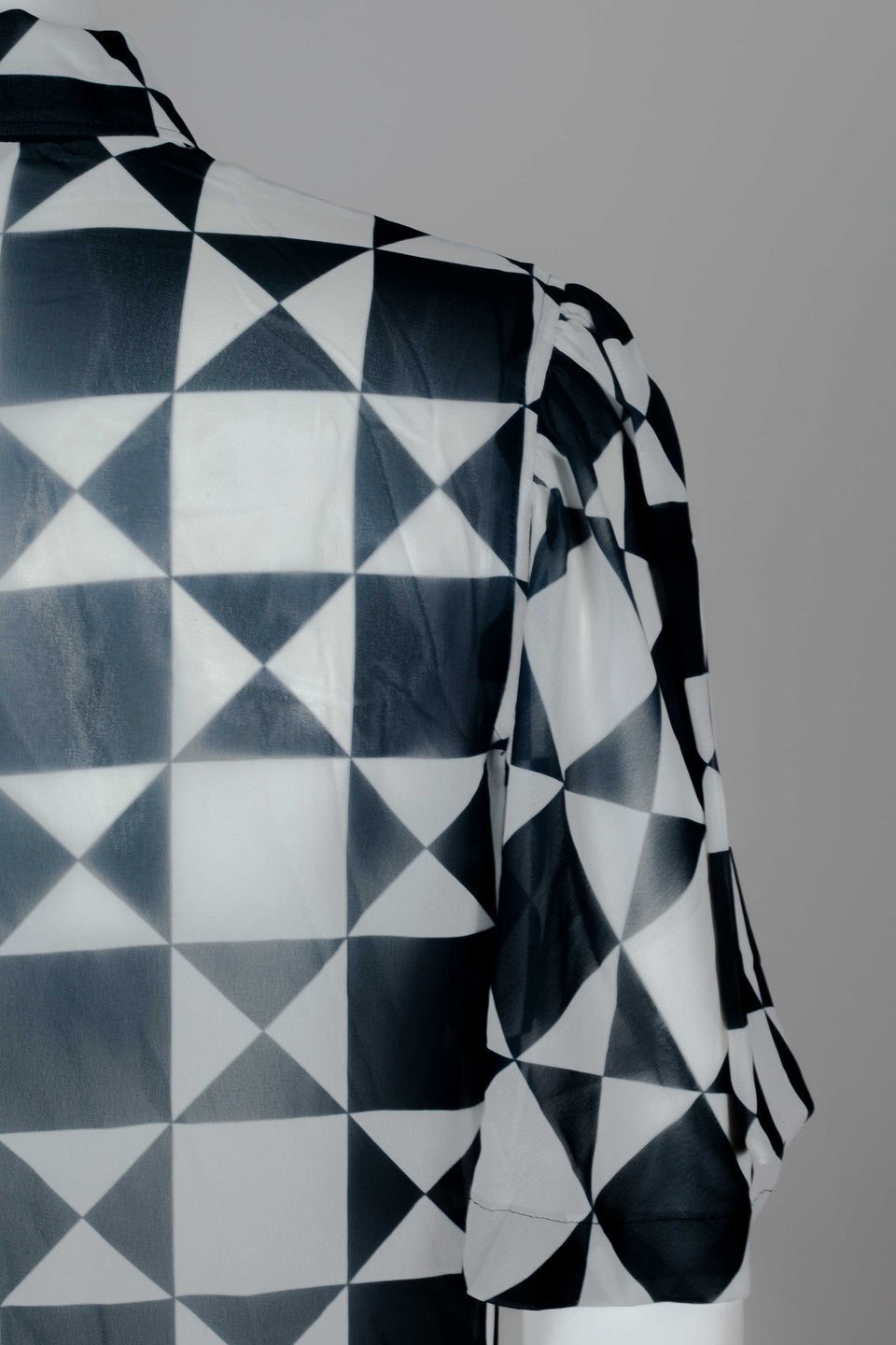 Comme des Garçons 1989 chiffon blouse from Japan with black and white geometric motif, short lantern sleeves and cut away collar.