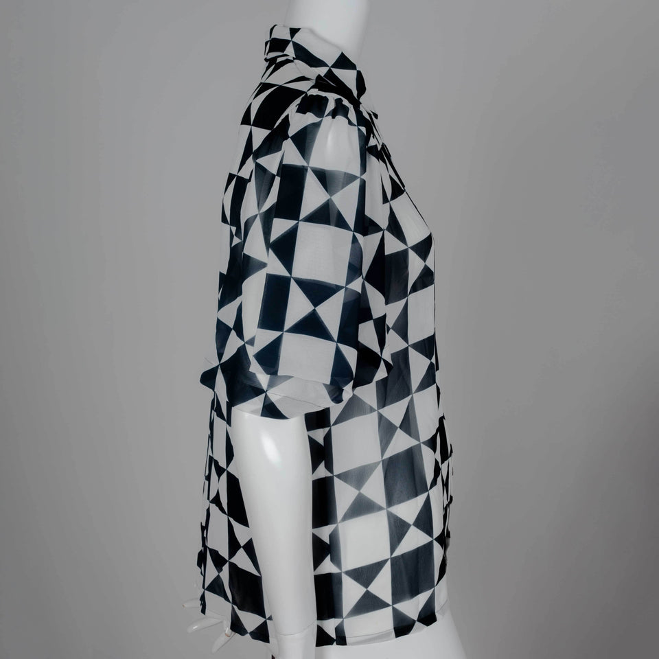 Comme des Garçons 1989 chiffon blouse from Japan with black and white geometric motif, short lantern sleeves and cut away collar.