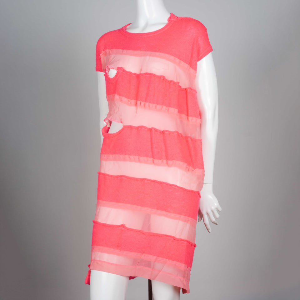 Comme des Garçons Tricot 2013, a neon pink sweater dress with alternating sheer horizontal strips. 