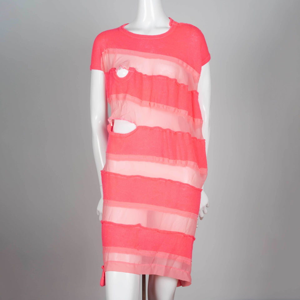 Comme des Garçons Tricot 2013, a neon pink sweater dress with alternating sheer horizontal strips. 
