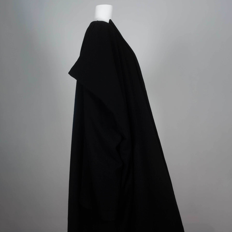 Comme des Garçons 1996 black wool wrap dress from Japan cut in a square with three quarter sleeves and an oversized cape style.