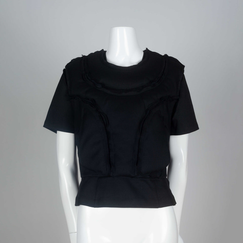 Comme des Garçons 2010 black wool top with padding on chest around collar and on torso.
