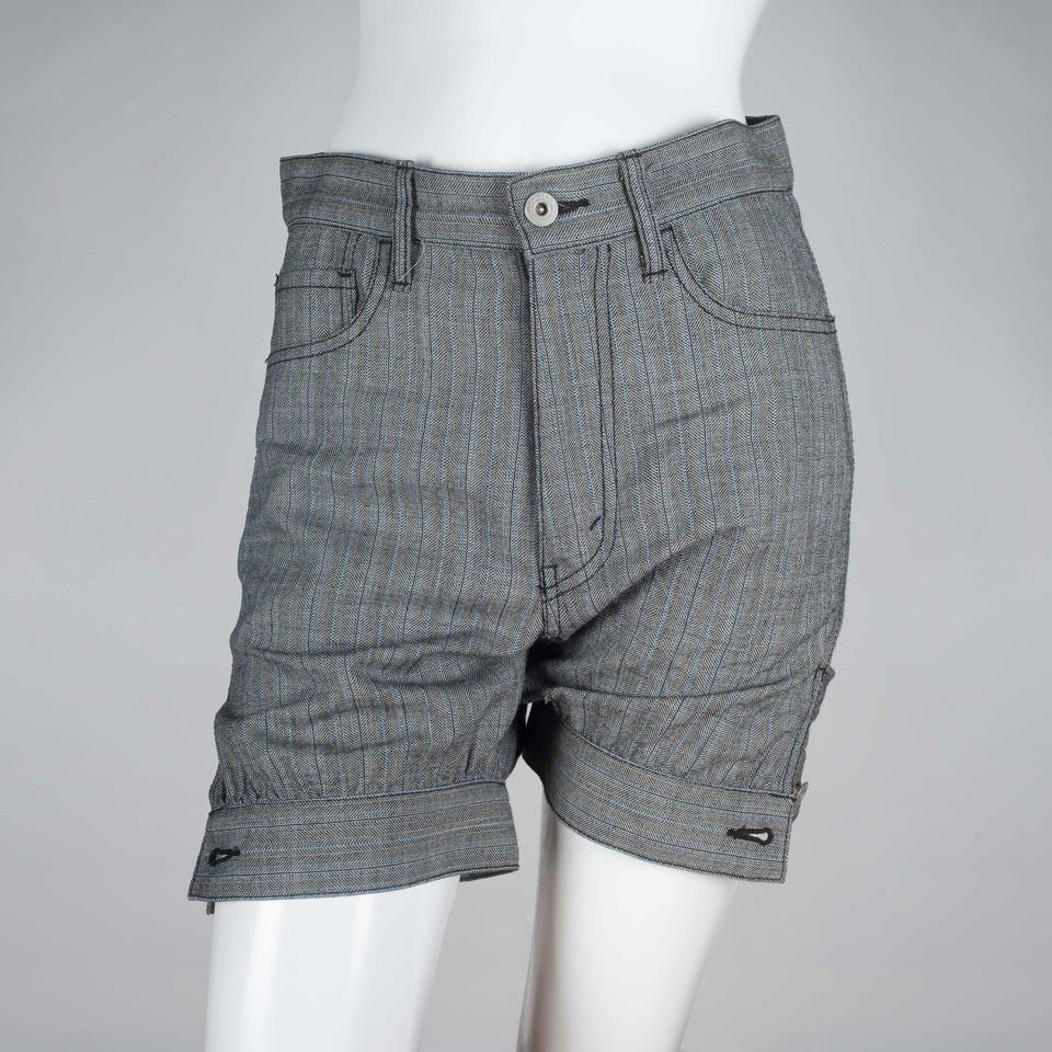 Junya Watanabe x Comme des Garçons 2007, gray wool shorts with pin stripe pattern, dark stitching and tapered, button hem. 