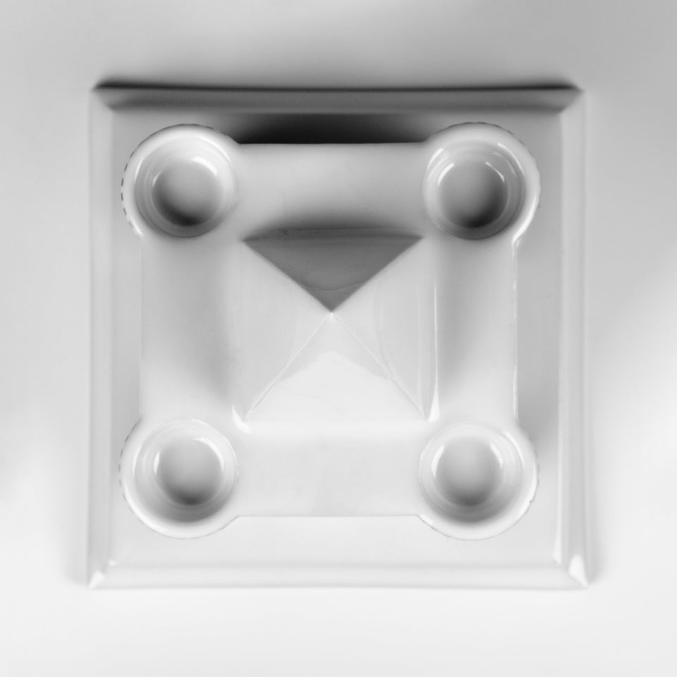 Candle holder in the shape of a Viennese castle in glazed porcelain with black and white painted graphics. 