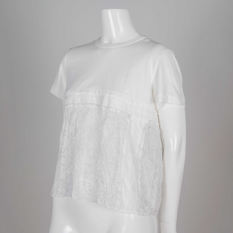 Comme des Garçons Tao, a white cotton t-shirt with embroidered linen lower that looks like lace.