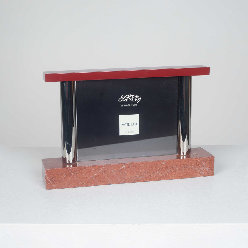 Picture frame in red marble by Italian designer, Ettore Sottsass. 